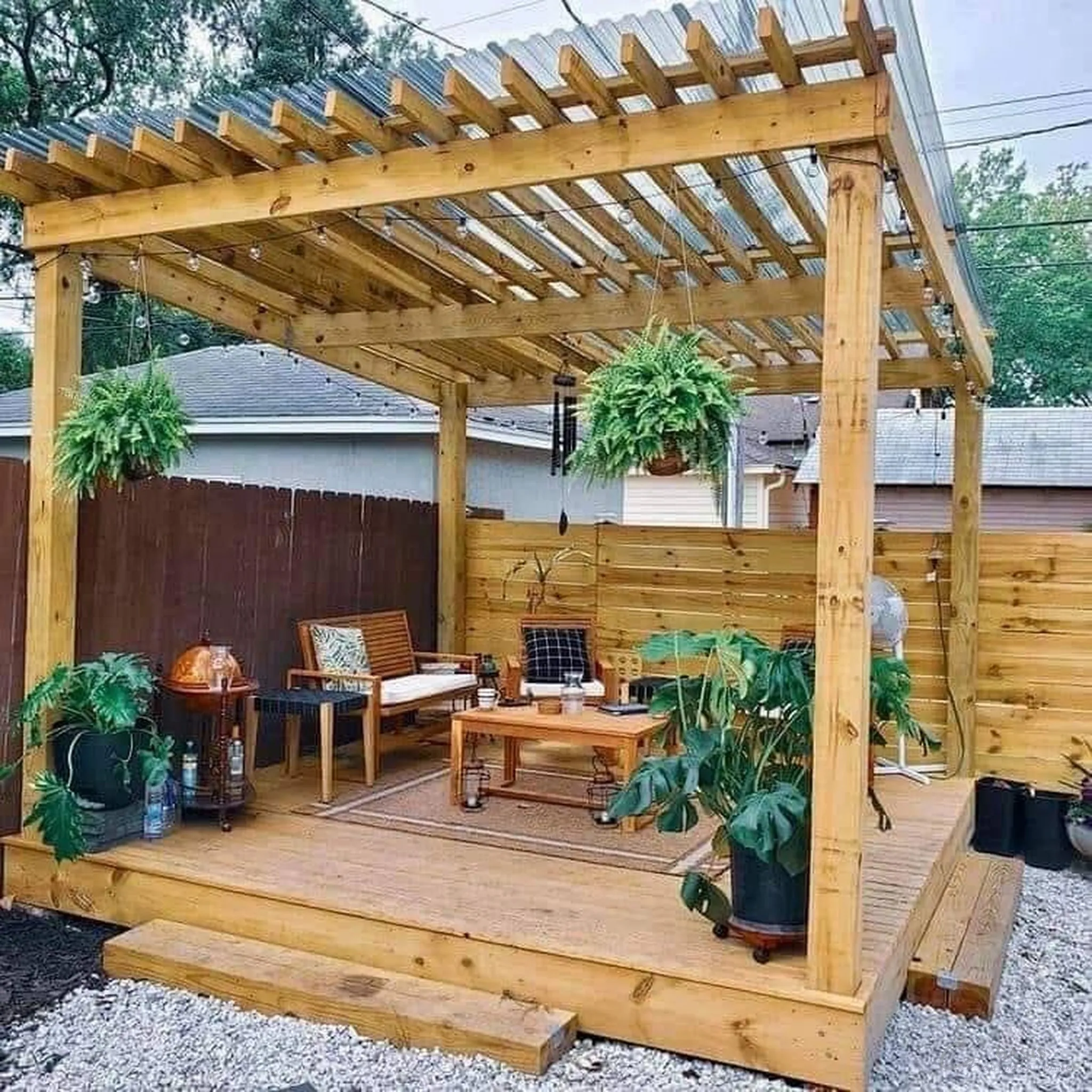 Pergola deck with hanging ferns