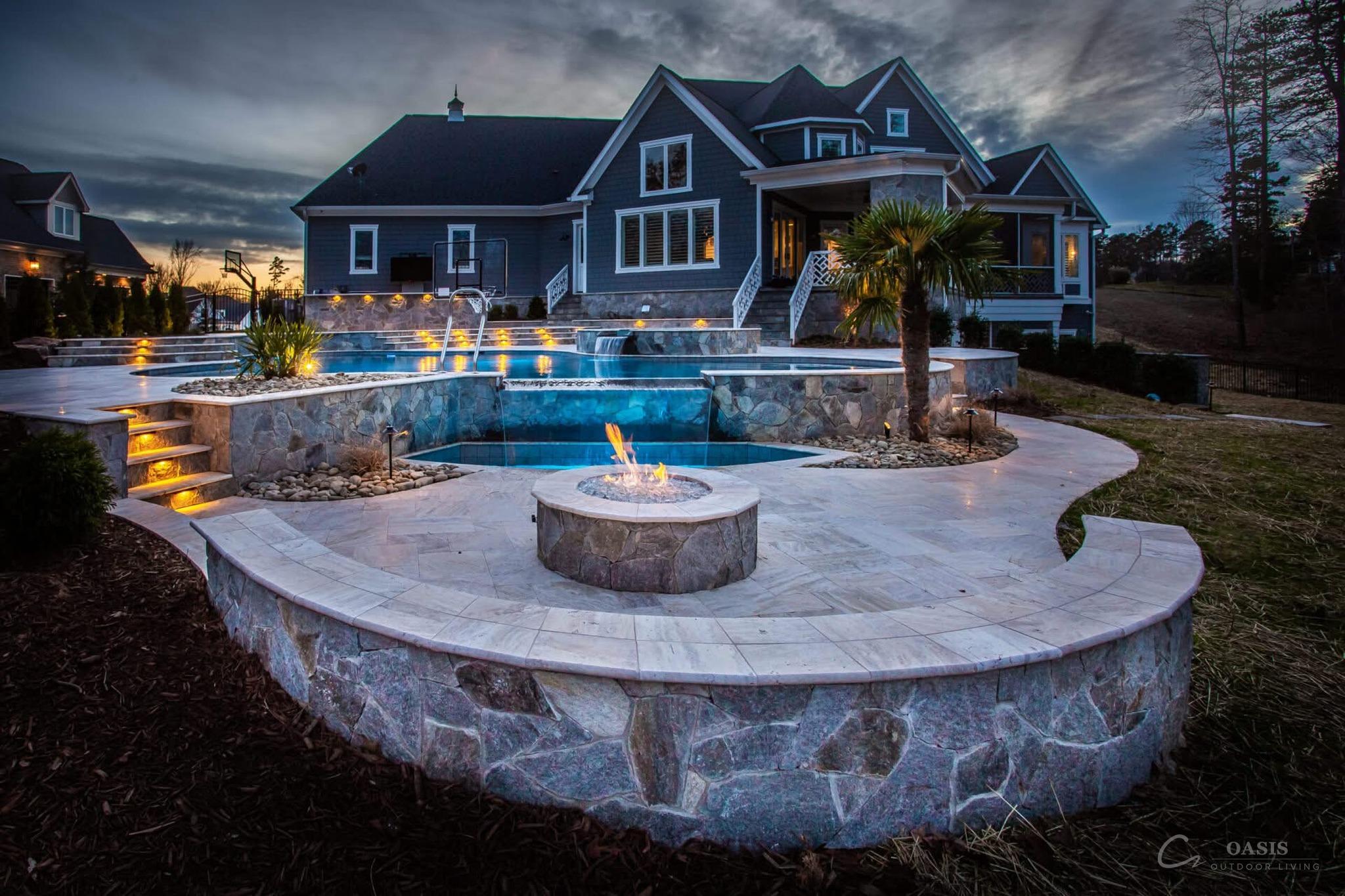 Twilight estate with pool and fire pit